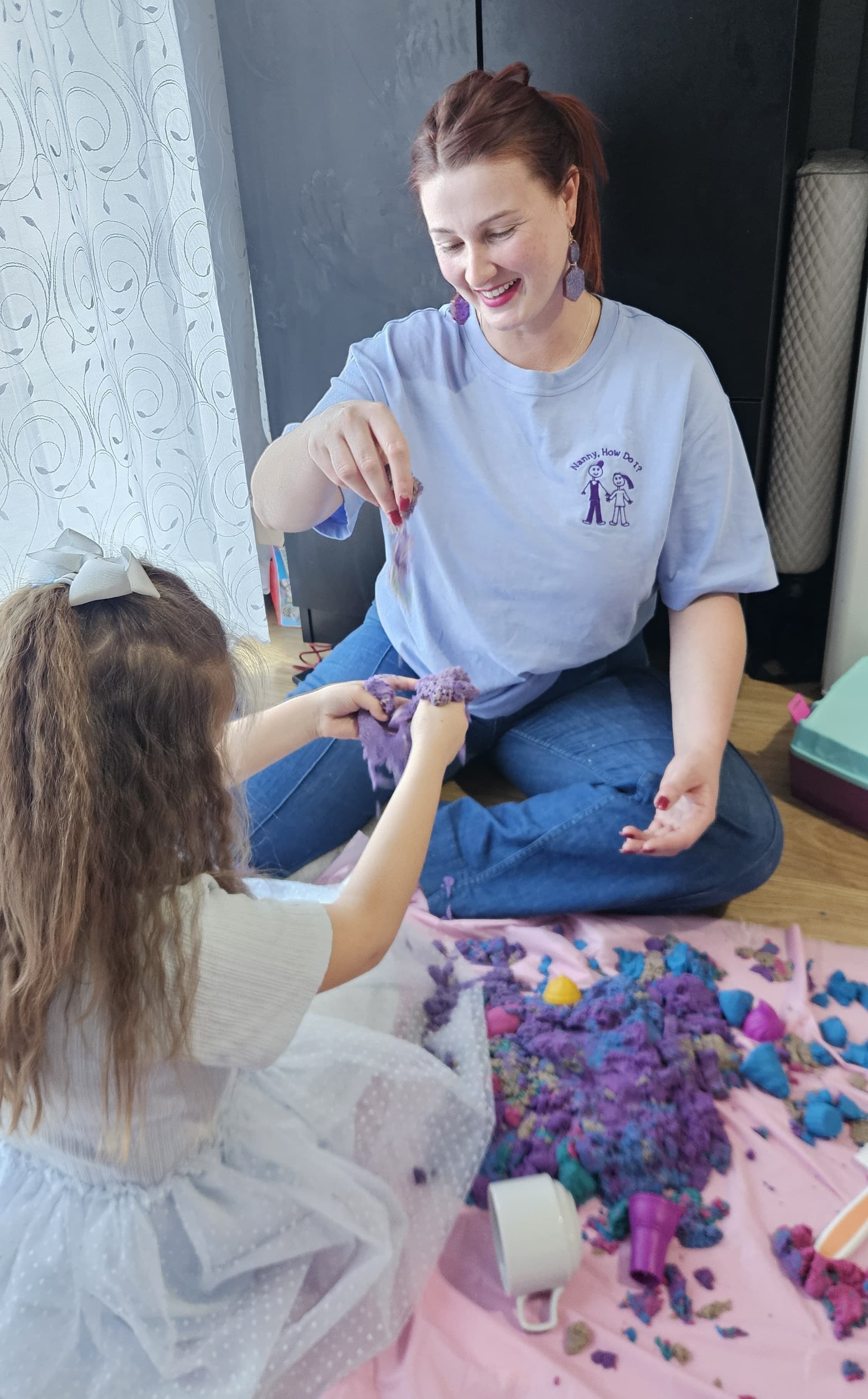 Antonia with a child during a playful activity session.